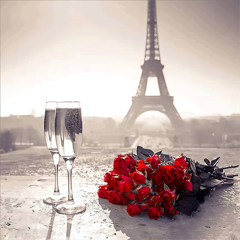 Eiffel Tower with champagne glasses and bouquet of red roses in Paris romantic scene