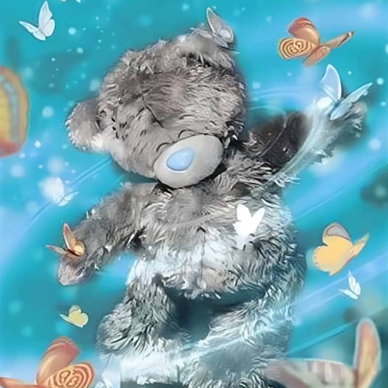 Cute gray teddy bear surrounded by colorful butterflies on a blue, dreamy background.