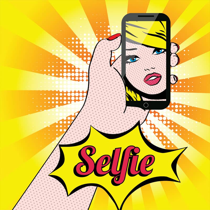Pop art style illustration of a hand holding a smartphone displaying a woman's face with the text "Selfie" in bold letters.