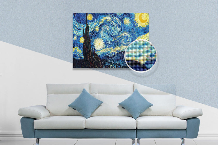 Diamond painting of Starry Night above modern white couch with blue pillows in living room