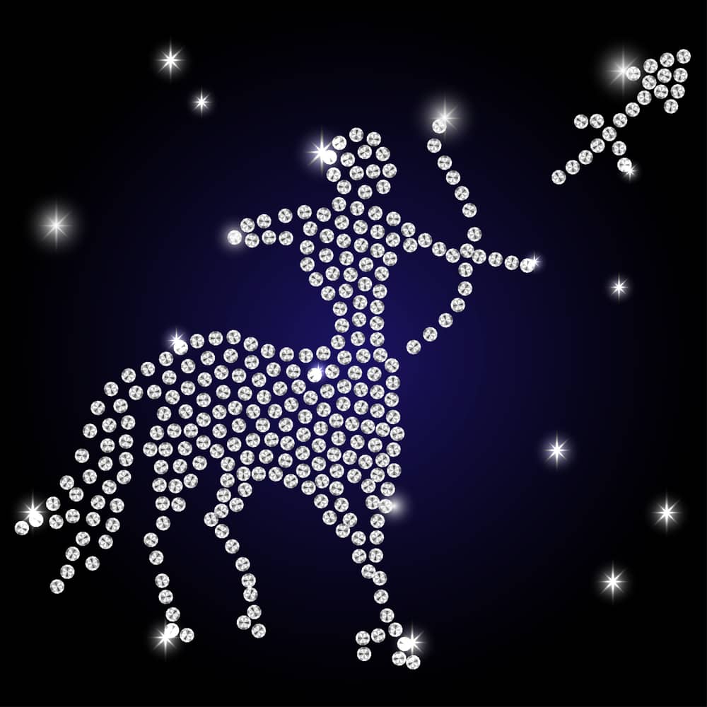 Diamond painting of the Sagittarius zodiac sign with sparkling stars on a dark background.