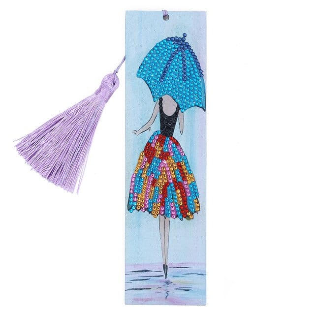 Diamond Painting Bookmark with colorful dress design, purple tassel, and blue umbrella for book lovers and craft enthusiasts.