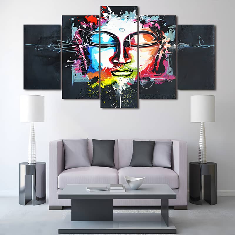 Colorful 5-piece diamond painting of Buddha displayed above a modern living room sofa.