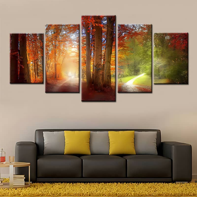 Diamond Painting 5 pieces showcasing paths through vibrant autumn and summer forests, mounted above a modern sofa