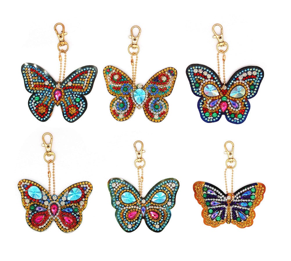 Colorful butterfly diamond painting keyring pendants arranged in a grid.